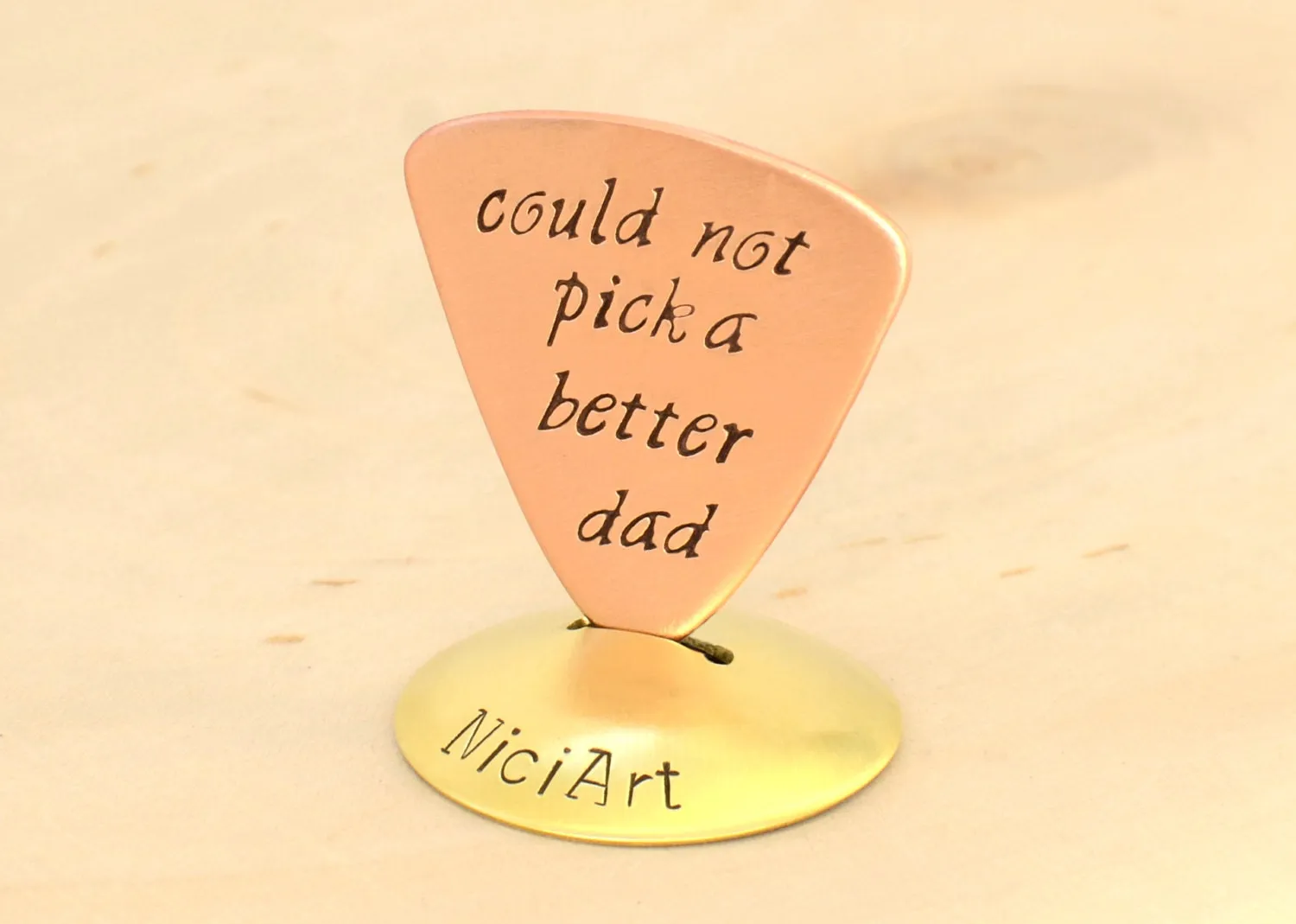 Copper Triangular Guitar Pick stamped with Couldn't Pick a Better Dad