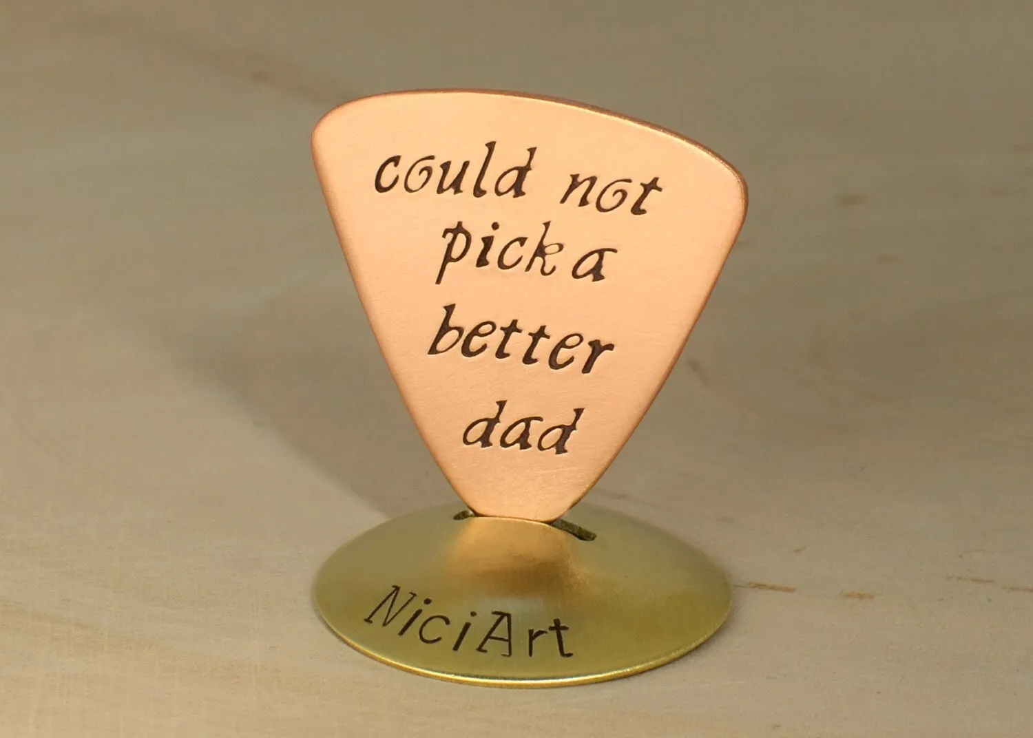 Copper Triangular Guitar Pick stamped with Couldn't Pick a Better Dad